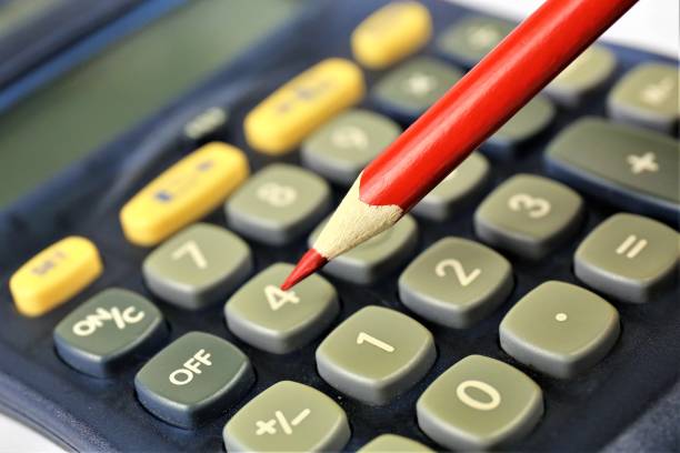 istock An concept image of a calculator with a pencil and copy space 915139844