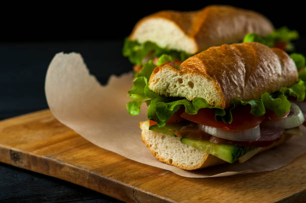 istock Tasty sandwiches with ham and vegetables 915140534