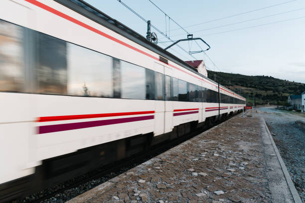 istock Train entering old railroad station platform in countryside 915140674