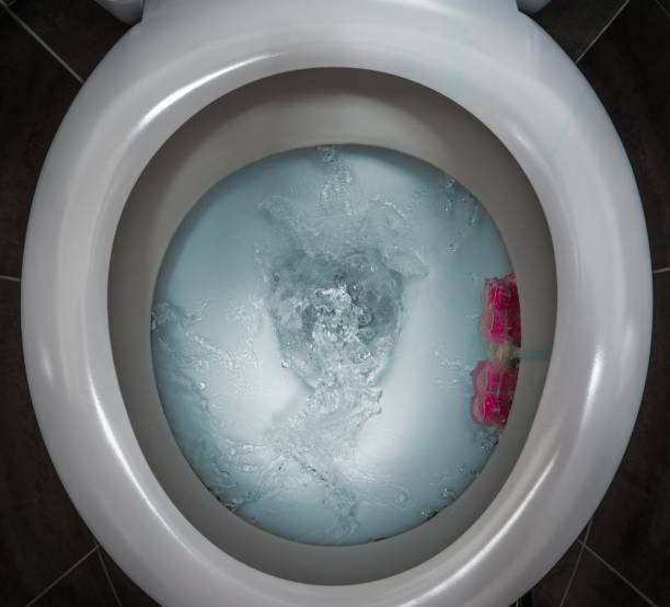 istock Water flushing  toilet 915140796