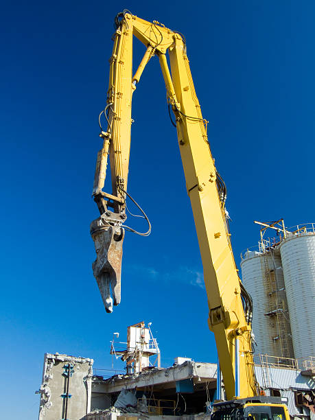 istock High Reach Excavator Arm. Yellow against deep blue sky 91514326