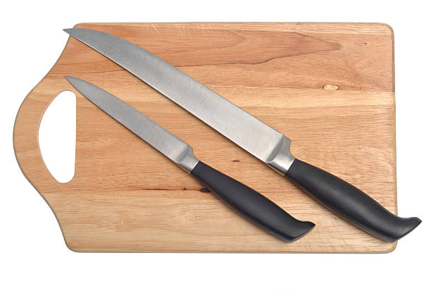 Cutting board and knives stock photo