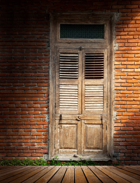 istock Brick wall with wooden door 915147658
