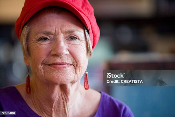 Senior Woman Wearing Red Hat Stock Photo - Download Image Now - Hat, Red, Senior Adult