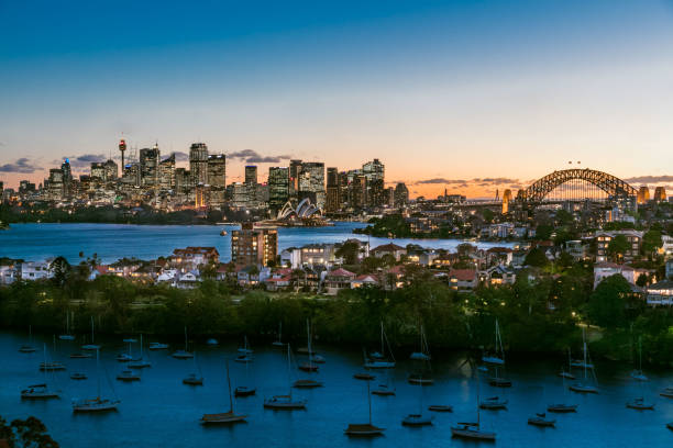 Panorama of Sydney City and Harbour on dusk City of Sydney panorama showing the Harbour Bridge and Opera House mossman gorge stock pictures, royalty-free photos & images