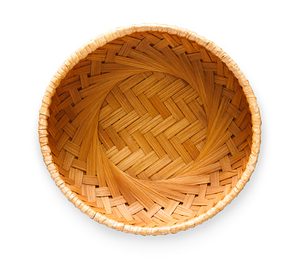 Top view on vintage wicker basket isolated on white background. Weave container for fruits, bread or easter eggs, cutout