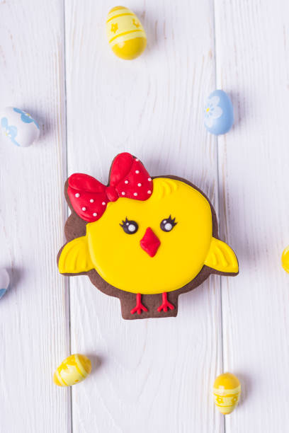 istock Happy Easter. Gingerbread chicken and easter eggs on a white background. Top view 915156628