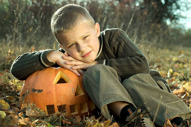 istock Little boy with pumpkin 91516439