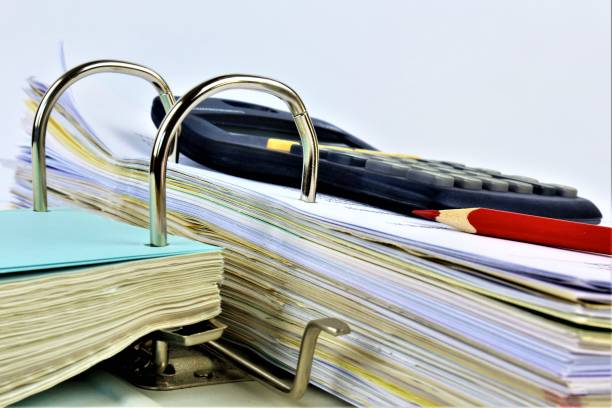 istock An concept Image of a binder with a calculator 915165660
