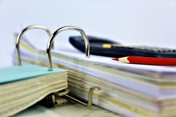 istock An concept Image of a binder with a calculator 915165664