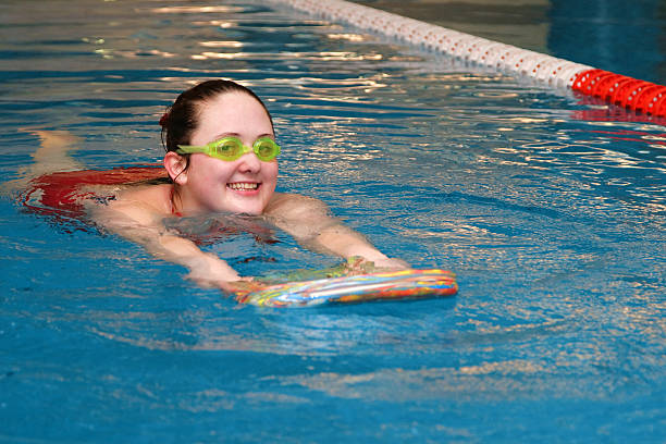 girl in the swimming pool stock photo