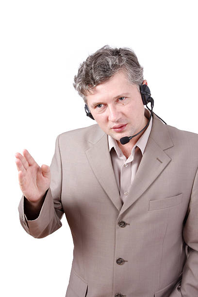 istock Successful  businessman is speaking over the headset with a microphone 91516740