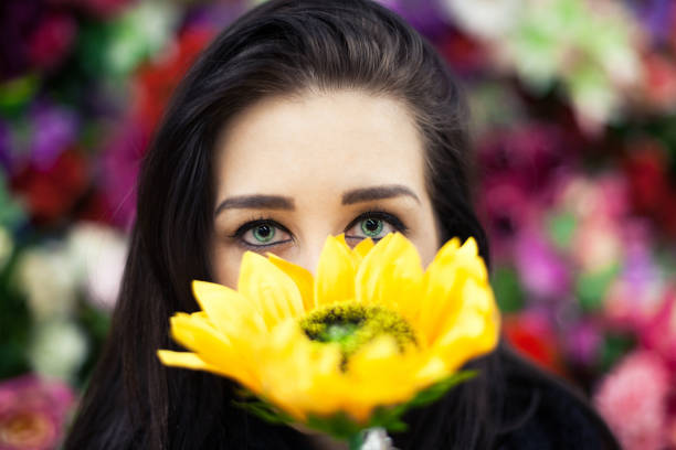 istock Girl holding flower 915169252