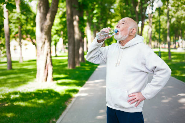 istock Senior man is having break, drinking water 915172618