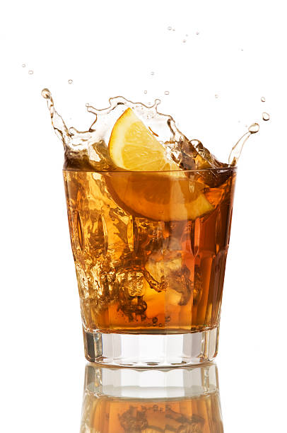 istock Brown drink with ice and lemon just dropped in 91517397