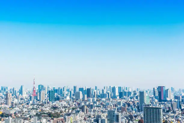 Asia Business concept for real estate and corporate construction - panoramic modern city skyline bird eye aerial view of tokyo tower under blue sky in Tokyo, Japan