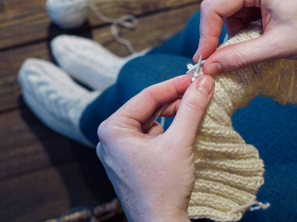 istock Woman is knitting 915178000