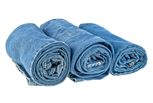 istock Lot of different jeans isolated on white background 915178662