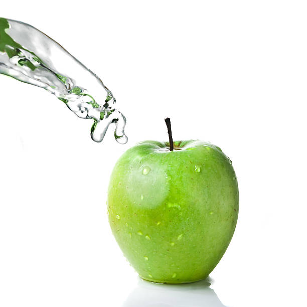 istock fresh water splash and green apple isolated on white 91518680