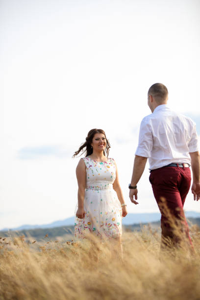 istock Loving couple in summer meadow 915190602