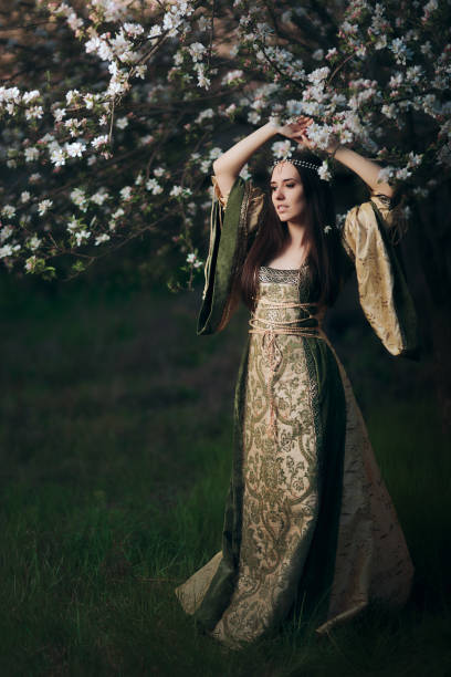 istock Beautiful Spring Fairy Princess Next to Blooming Tree 915191146