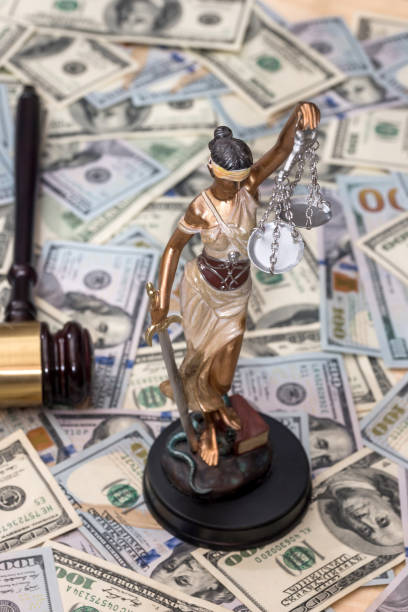 istock Justice Scale and wooden hammer on dollar bills 915193830