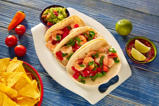 Camaron shrimp tacos mexican food on blue wood table