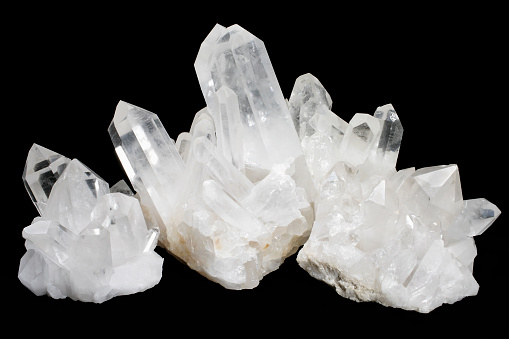 Scolecite crystals of the zeolite group. Geology; Mineral; Scolecite; Silicate class; acicular needle like formation; color image; crystal form; horizontal; hydrated calcium silicate; luster; mineralogy; photograph; photography; pseudotetragonal crystal; spray of thin prismatic needles; tectosilicate mineral; vitreous luster; white; zeolite group