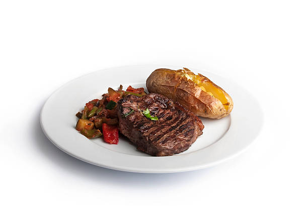 bistecca di manzo con patate al forno - food steak meat dinner foto e immagini stock