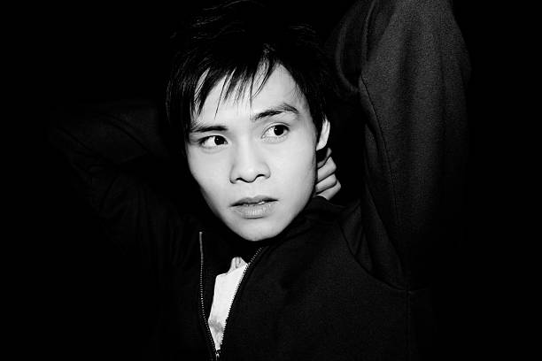 An Asian Chinese male selfie portrait with mobile phone at männlichen