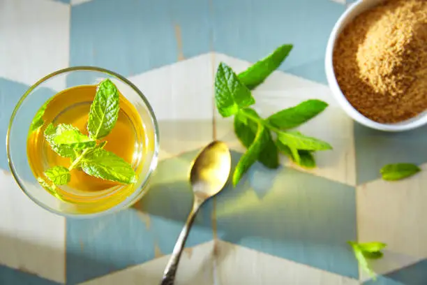 green tea with mint Moroccan style on wood blue white table