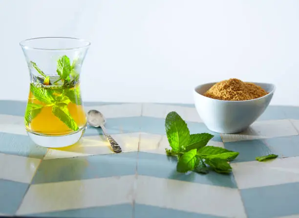 green tea with mint Moroccan style on wood blue white table