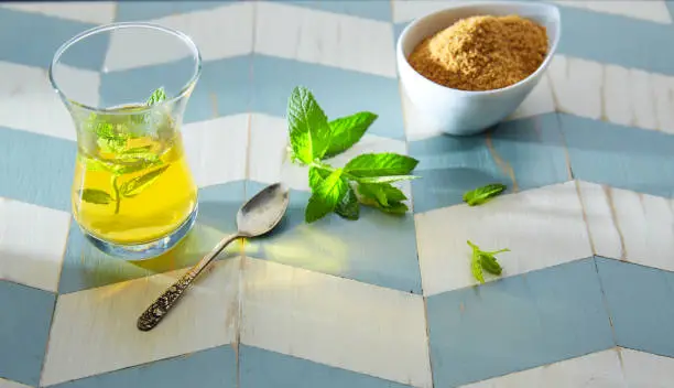 green tea with mint Moroccan style on wood blue white table