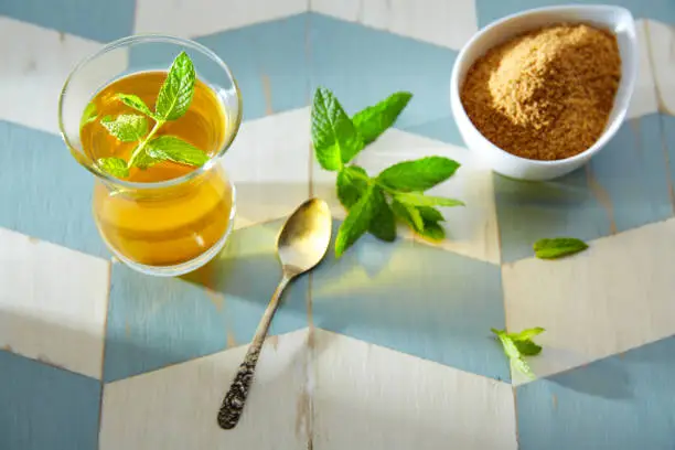 green tea with mint Moroccan style on wood blue white table