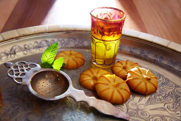 green tea with mint Moroccan style on silver tray and biscuits