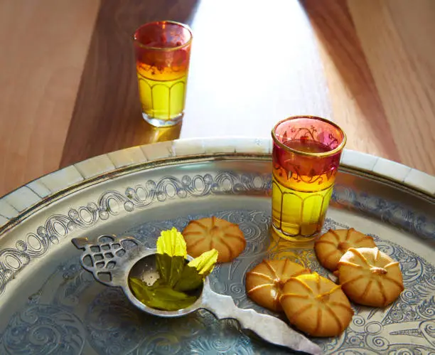 green tea with mint Moroccan style on silver tray and biscuits