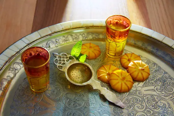 green tea with mint Moroccan style on silver tray and biscuits