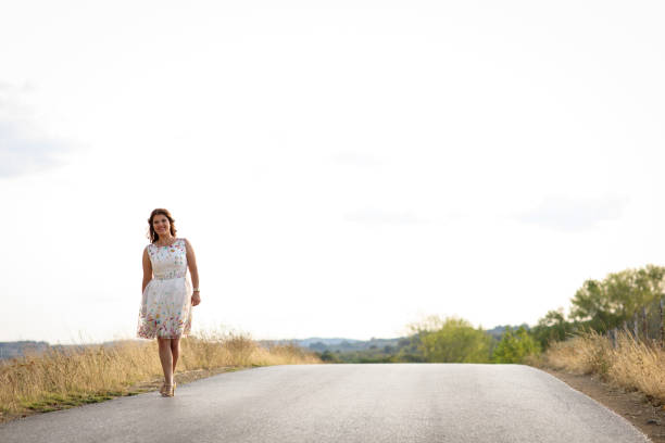 Woman walking on road