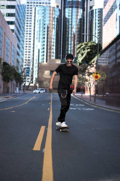 Group of friends skateboarding on city streets.