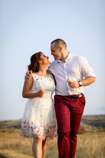 istock Loving couple in summer meadow 915205688