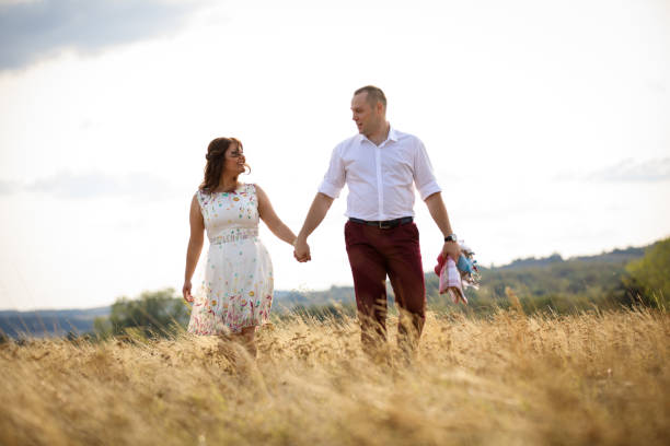 istock Loving couple in summer meadow 915205776