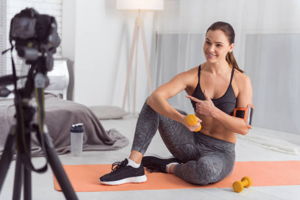 istock Inspired athletic blogger holding hand weight 915206346