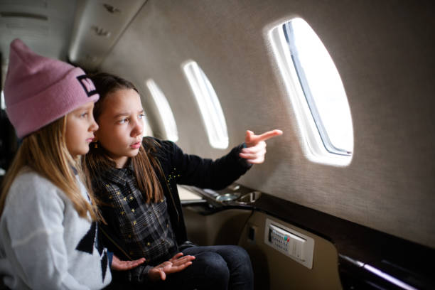 istock Girls in the airplane 915206844