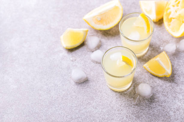 istock Italian lemon lime liqueur limoncello with ice and mint 915207068