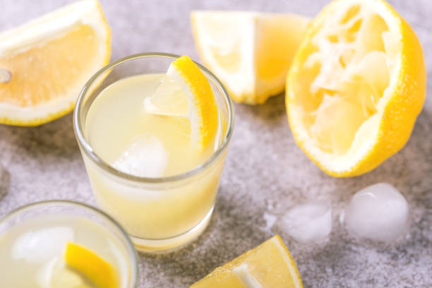 istock Italian lemon lime liqueur limoncello with ice and mint 915207178
