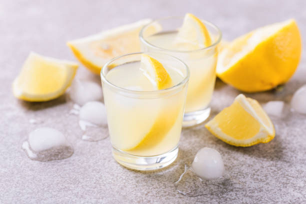 Italian lemon lime liqueur limoncello with ice and mint