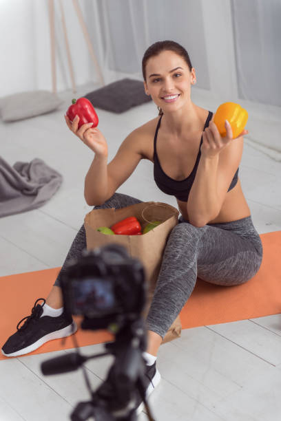 istock Inspired blogger talking about healthy eating for camera 915210444