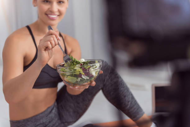istock Smiling blogger talking about importance of fresh vegetables 915210472