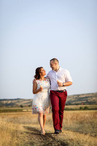 istock Loving couple in summer meadow 915210724