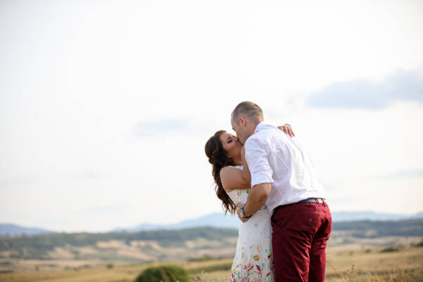 istock Couple kissing in nature 915213258